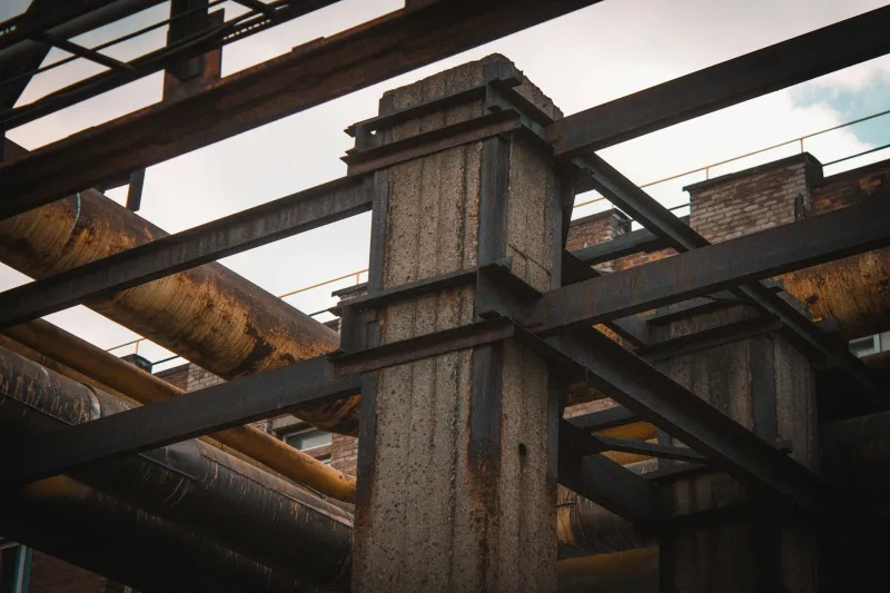 Steel column and beams of an industrial frame against the sky